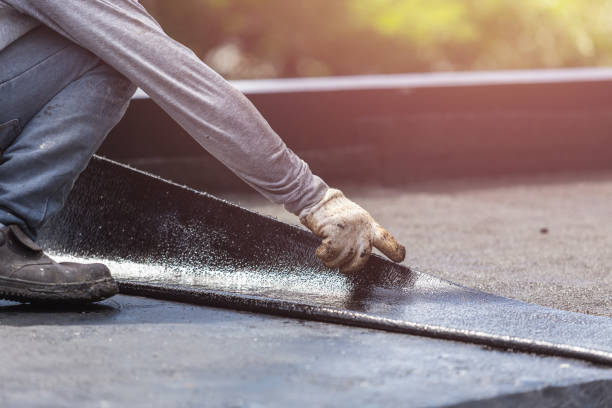 Professional Basement Waterproofing technician working in Fayetteville, OH